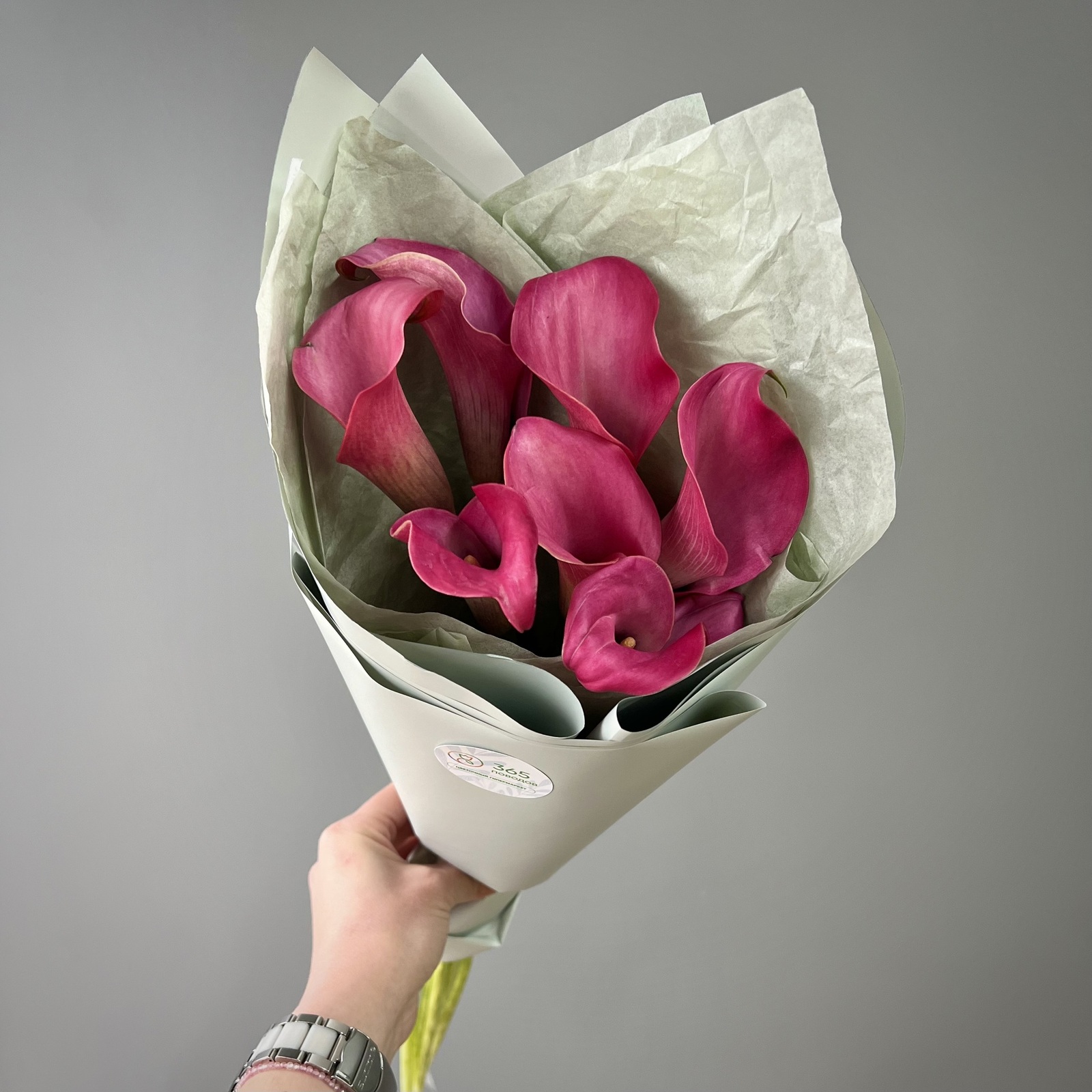 Букет из 7 малиновых калл